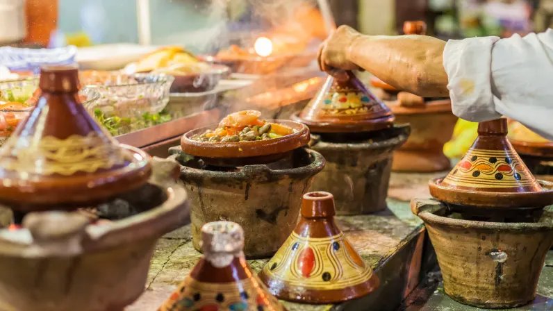 Moroccan dishes served in bowls on a table